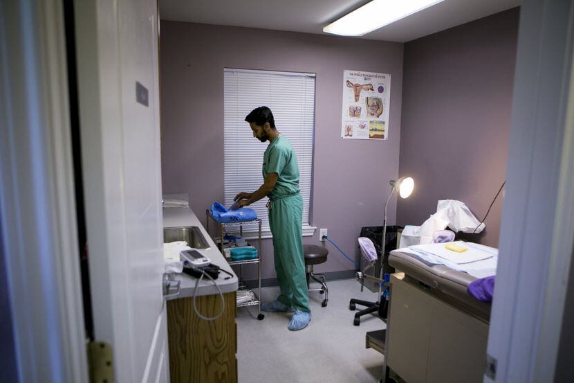 Dr. Bhavik Kumar prepares a procedure room for a patient at Whole Woman's Health clinic in...