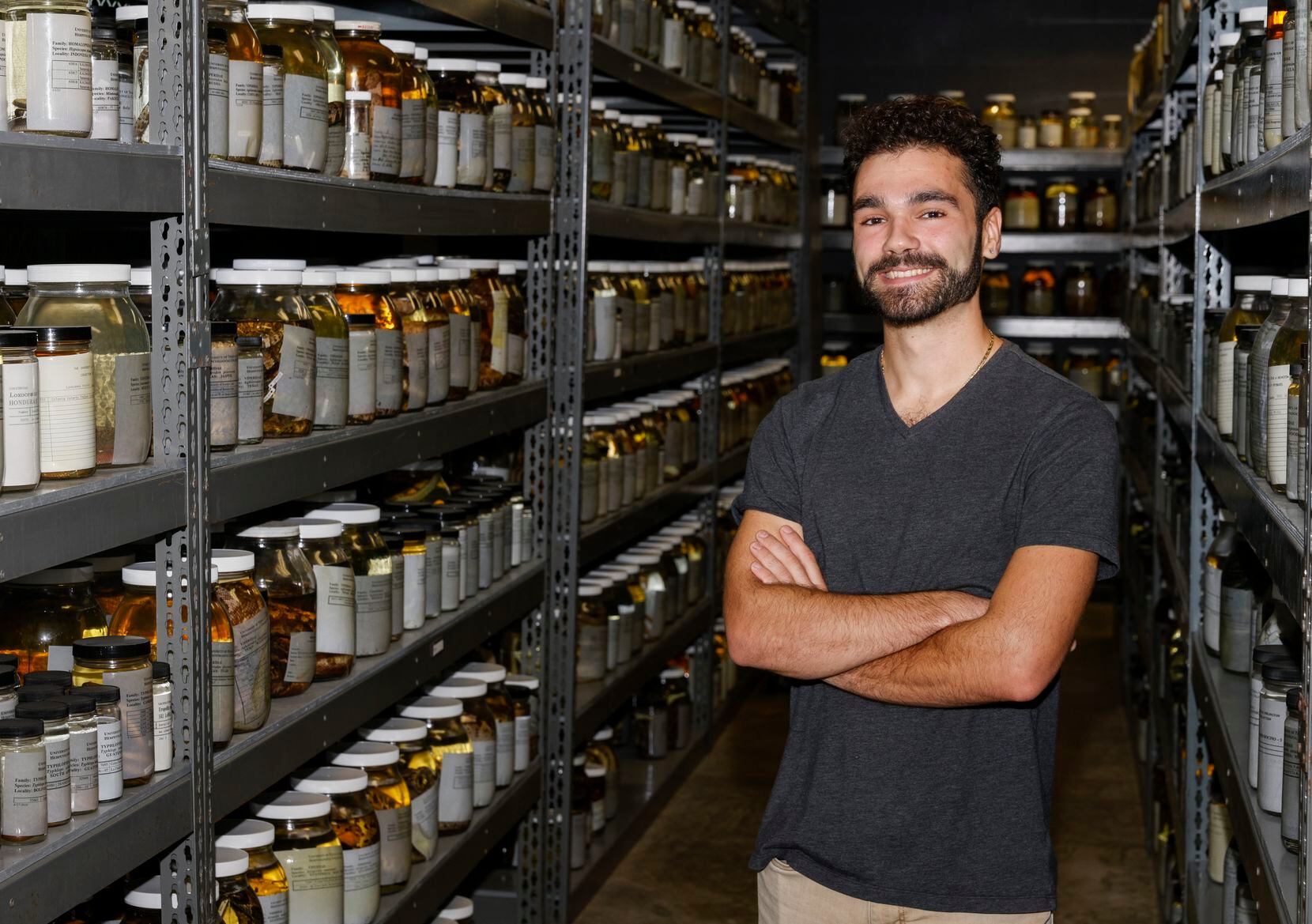Curator Greg Pandelis stands amongst thousands of preserved specimens at the Amphibian and...
