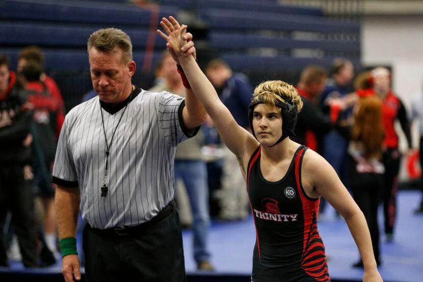 Euless Trinity's Mack Beggs is announced as the winner of a semifinal match after he pinned...