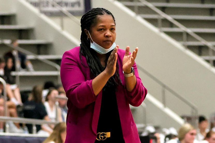 Hebron head coach Lisa Branch applause her team against Flower Mound on January 10, 2023 at...