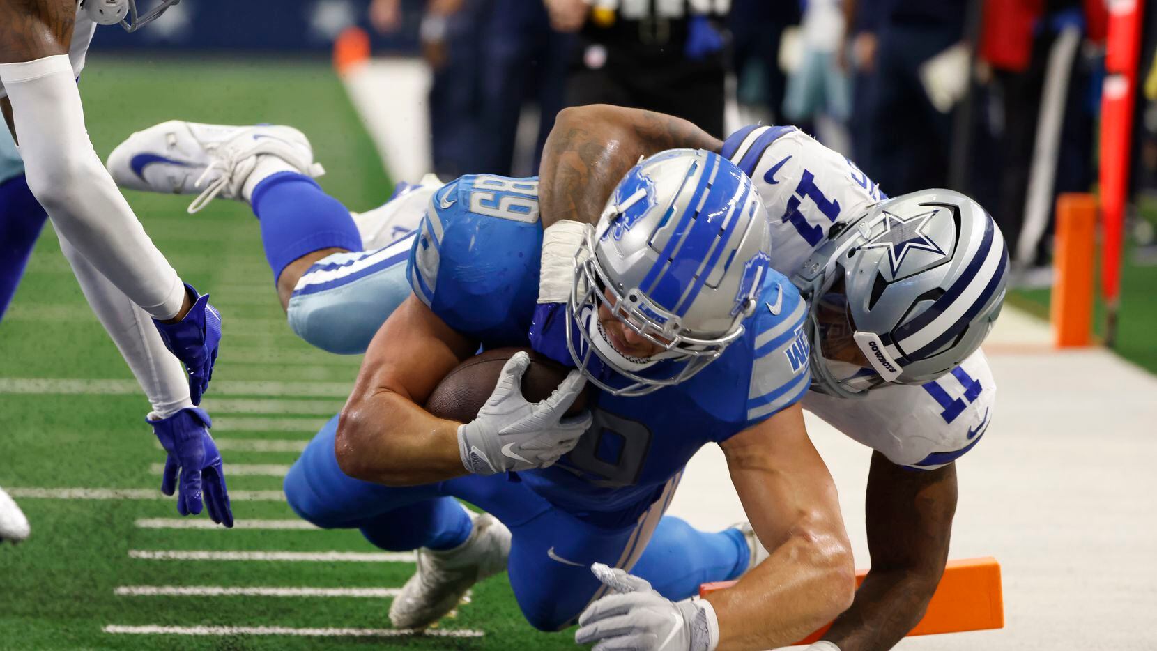 Detroit Lions tight end Brock Wright (89) is tackled at the 1-yard line by Dallas Cowboys...
