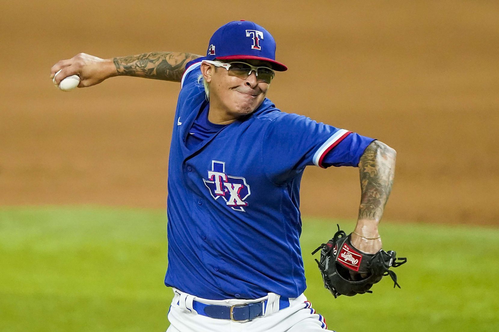 Texas Rangers pitcher Jesse Chavez pitches during the sixth inning of an exhibition game...
