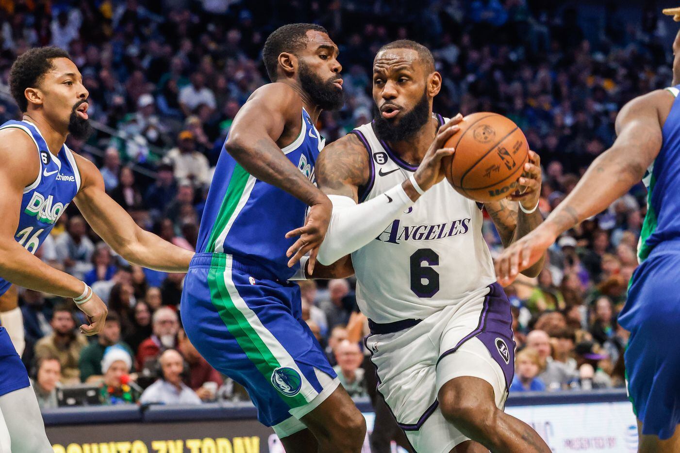 Los Angeles Lakers forward LeBron James (6) goes around Dallas Mavericks forward Tim...