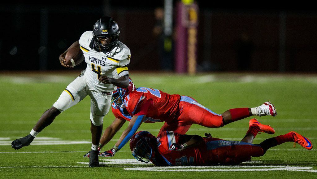 Crandall running back Chris Abron (4) escapes a tackle by Carter defensive back Kyree Corbin...