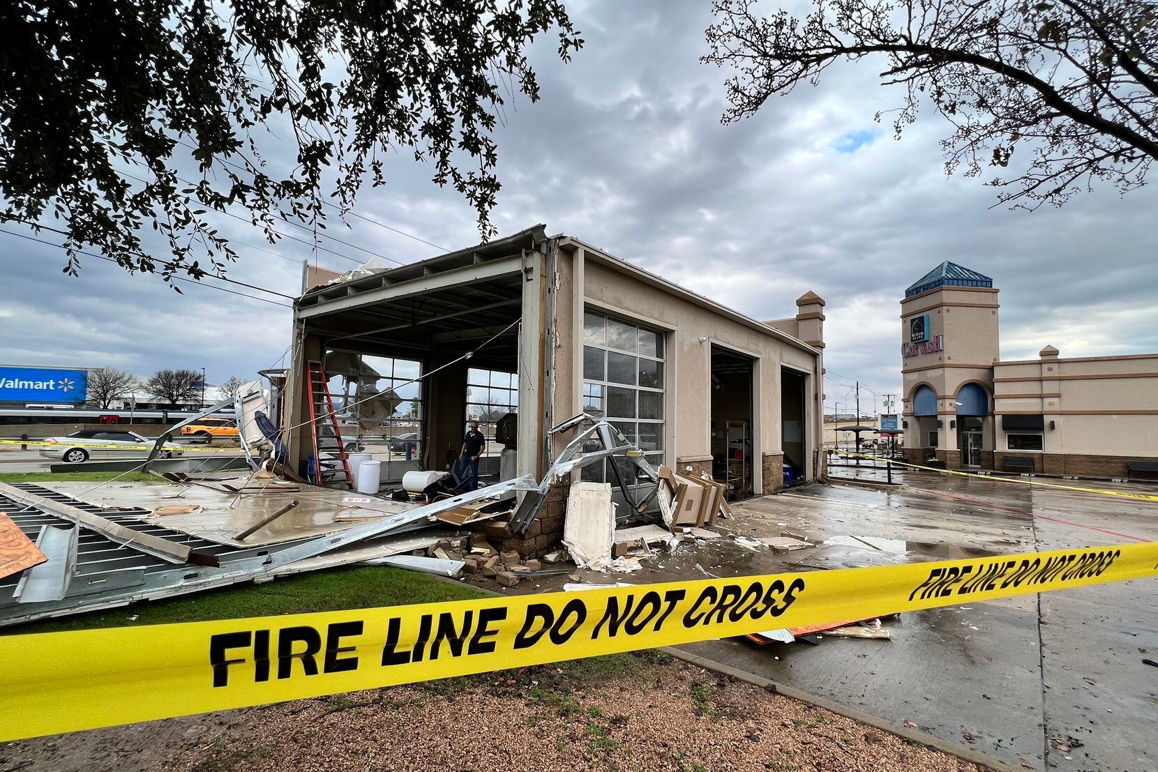 Storm damage is seen at Mustang Elite Car Wash & Lube Center on Ira E. Woods Avenue in...