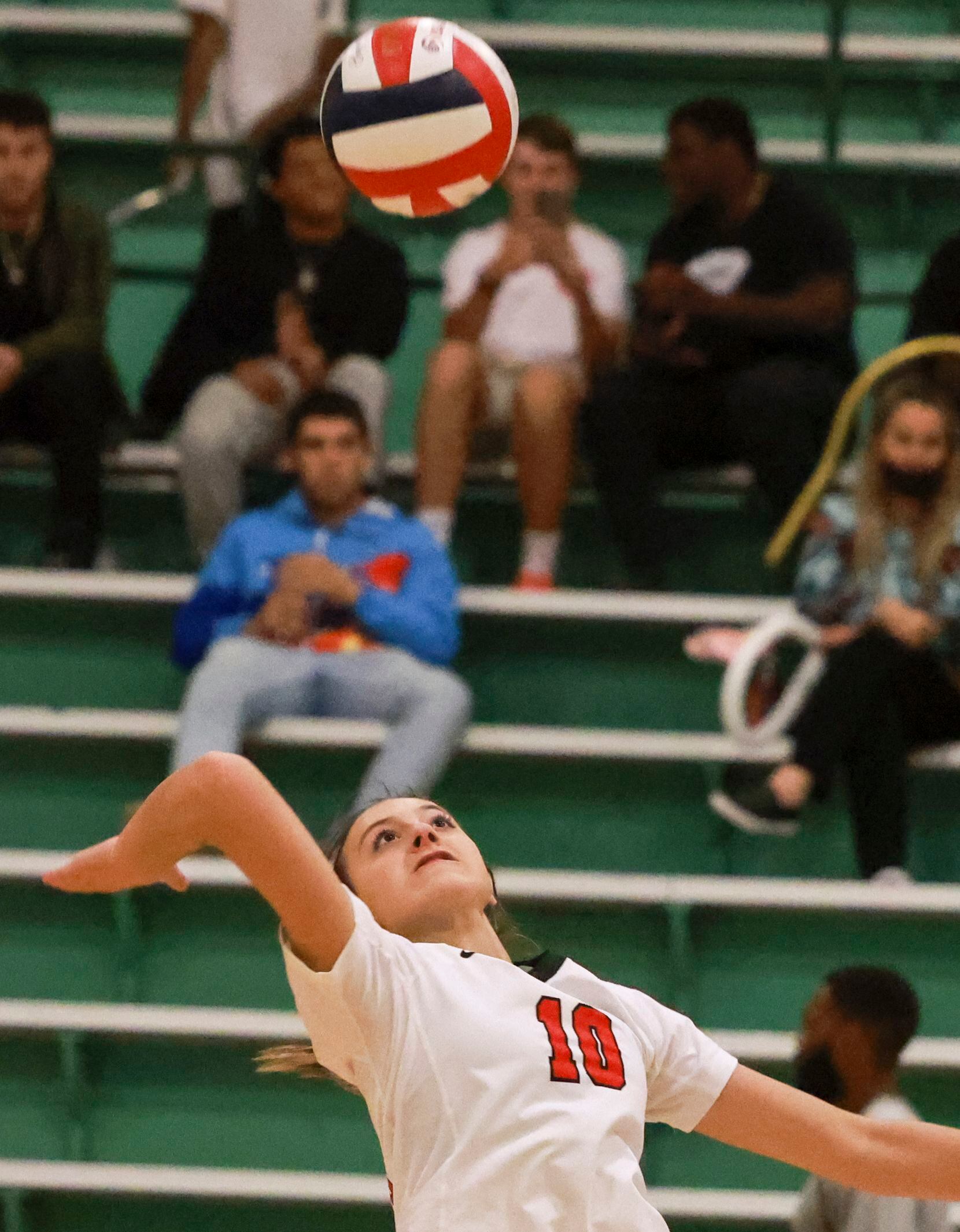Lake Highlands High School Payton Tompkins (10) spikes the ball during the volleyball game...