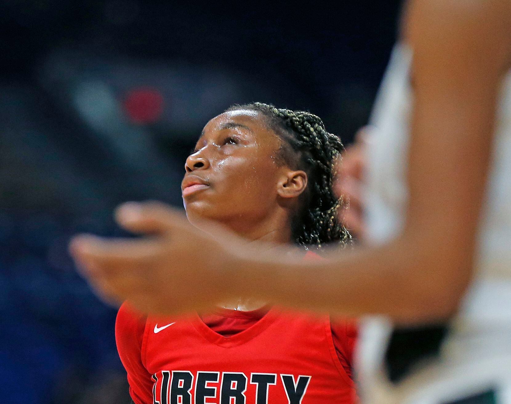 Frisco Liberty Jazzy Owens-Barnett #30 reacts after missing a free throw late in fourth...