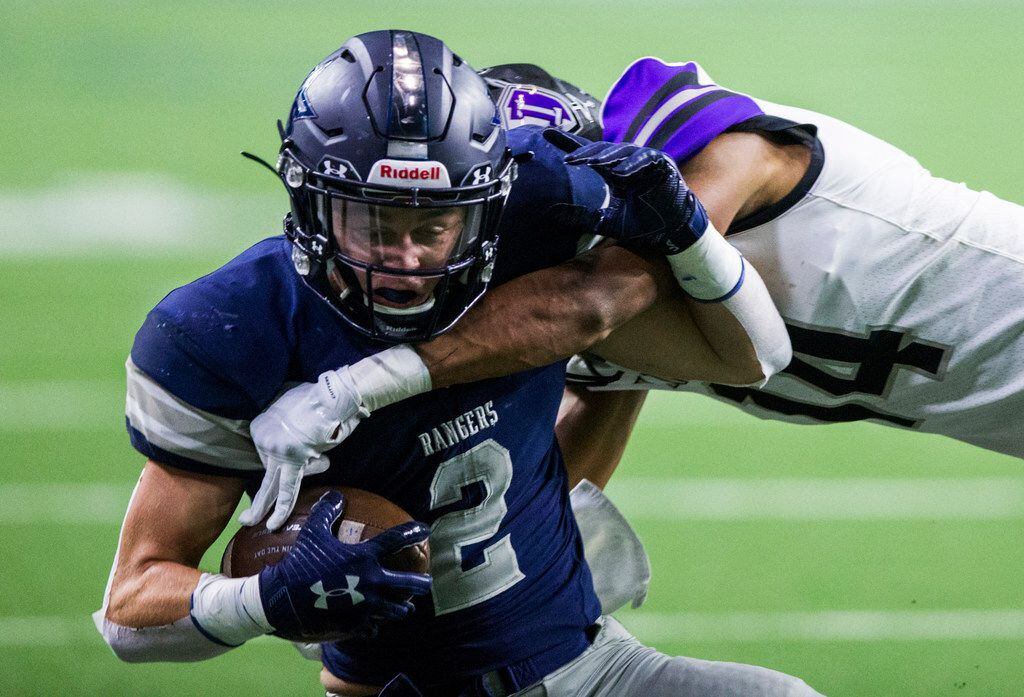 Frisco Lone Star wide receiver Jake Bogdon (4) is tackled by Frisco Independence defensive...