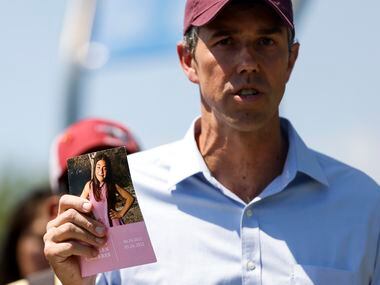 Democratic gubernatorial candidate Beto O'Rourke holds a card dedicated to one of the Uvalde...