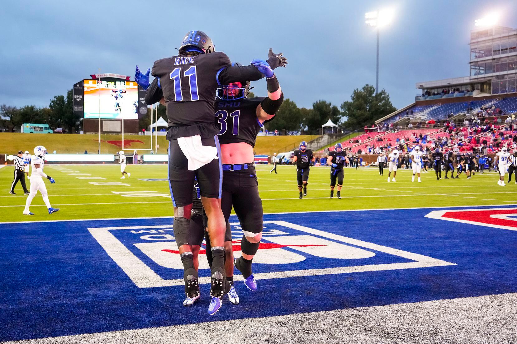 SMU wide receiver Rashee Rice (11) celebrates with running back Tyler Lavine (31) after...