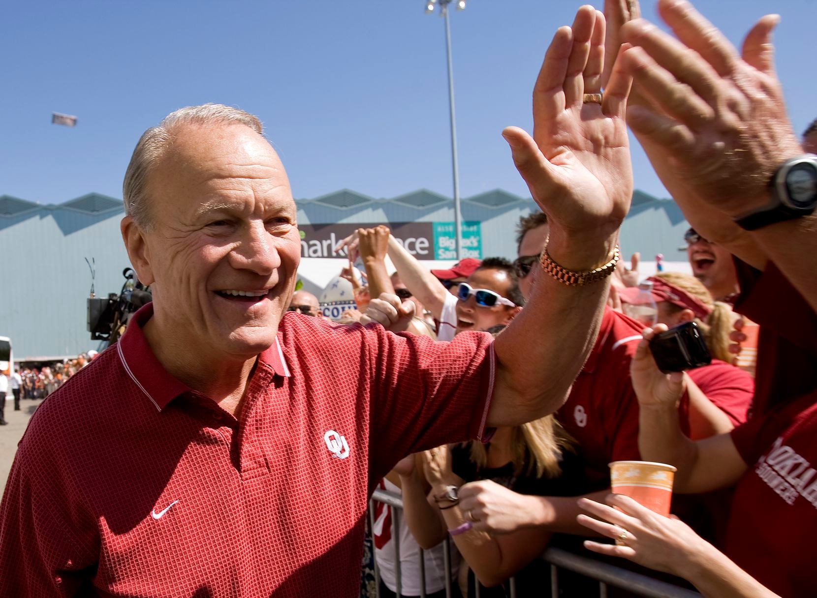Former Oklahoma coach Barry Switzer meets fans before the Texas OU game at the Cotton Bowl in Dallas, Oct. 2, 2010. 