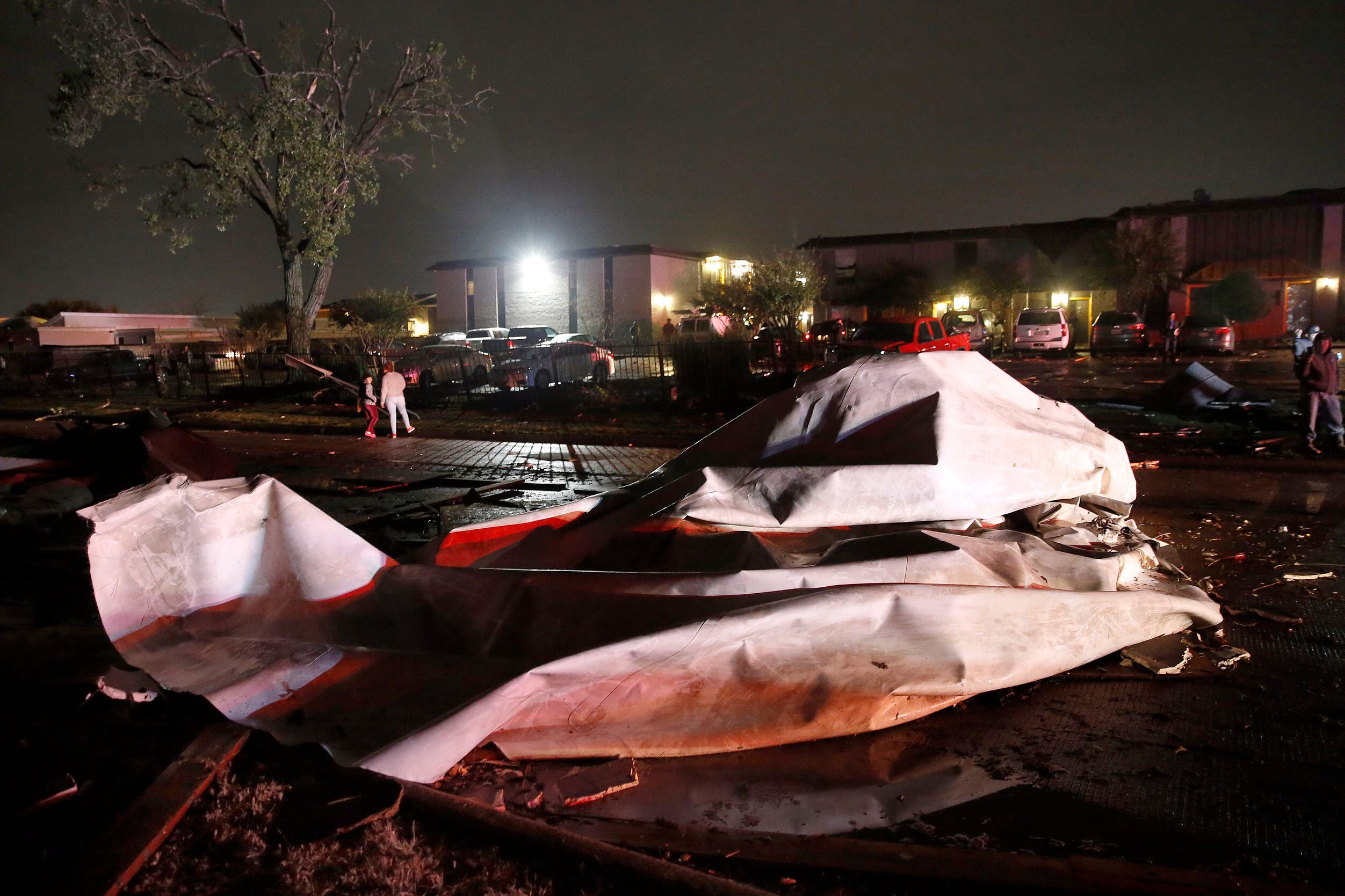 Roofs from The Mirage Apartments complex were torn off and landed on Pioneer Parkway in...
