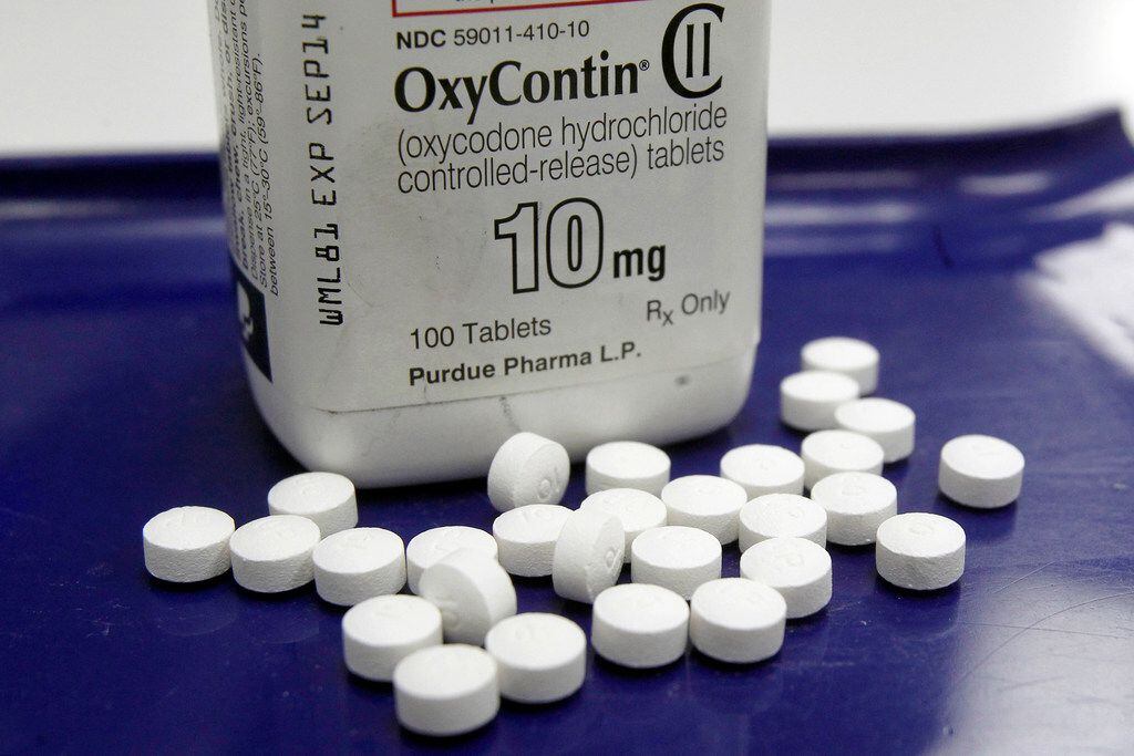This Feb. 19, 2013, file photo shows OxyContin pills arranged for a photo at a pharmacy in...