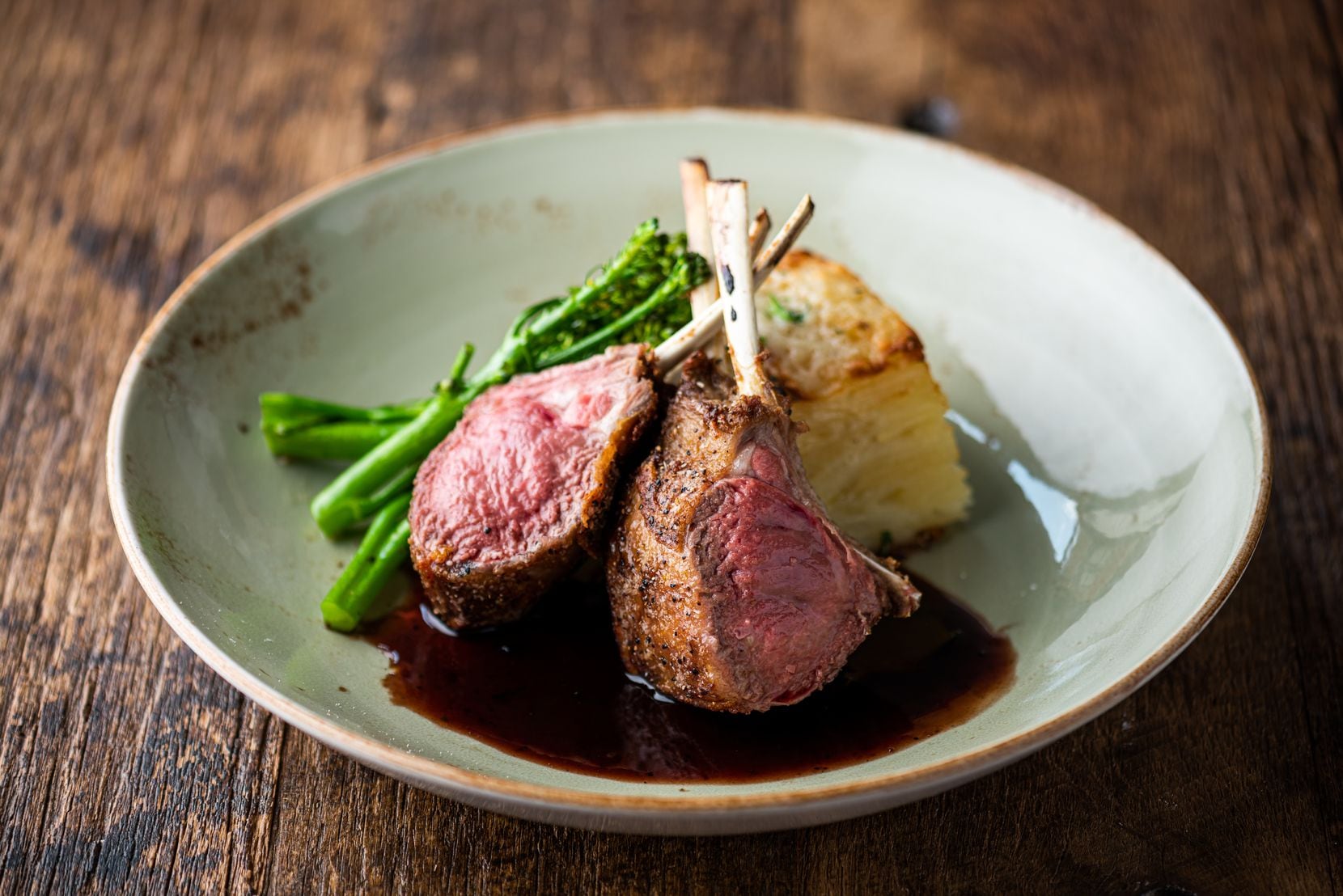 Cru Food and Wine Bar offers roasted rack of lamb with rosemary fingerling potatoes, blue...