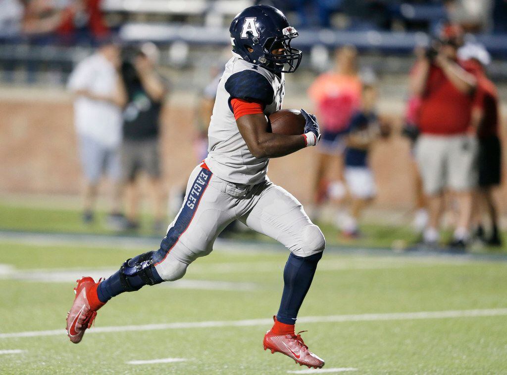 Allen's Celdon Manning (1) runs in after the catch for a touchdown in a game against Jesuit...