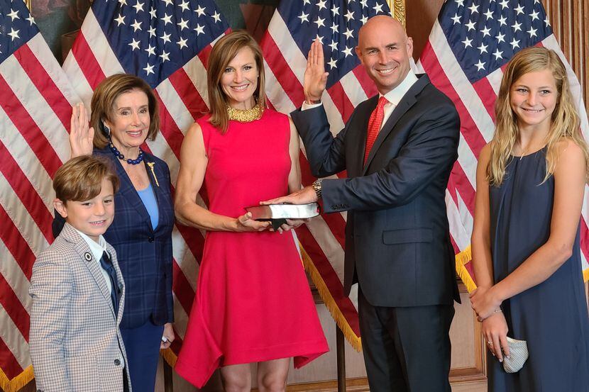 House Speaker Nancy Pelosi poses for a ceremonial swearing-in with Rep. Jake Ellzey on July...