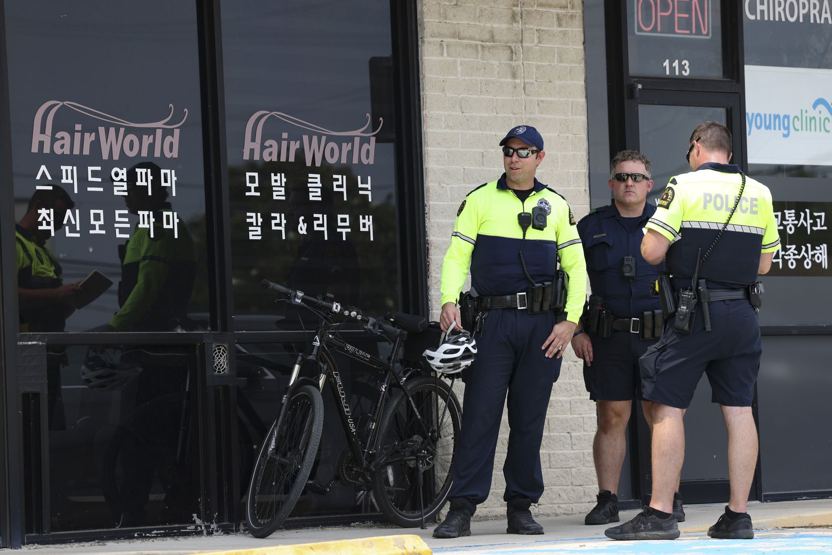 Police stand outside Hair World Salon Tuesday, May 17, 2022 in Dallas, Texas.  Dallas...