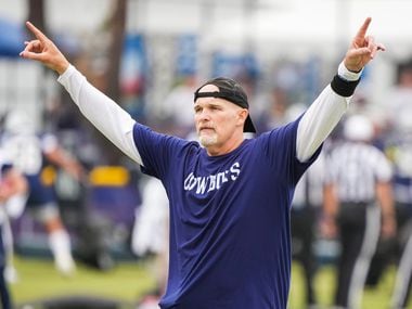 Dallas Cowboys defensive coordinator Dan Quinn motions to players during a practice at training camp on Saturday, July 24, 2021, in Oxnard, Calif.