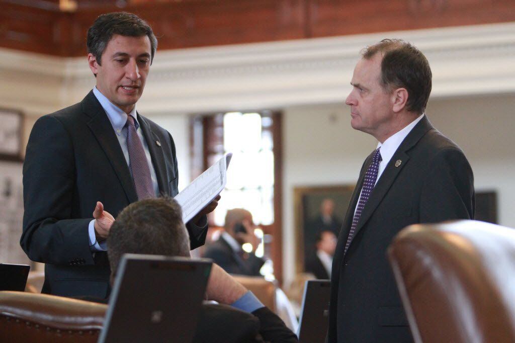  Rep. Giovanni Capriglione, R-Southlake (left), shown speaking with a colleague during his first session in 2013, is considered an expert on finance and cybersecurity. (Charlie L. Harper III/Special Contributor)