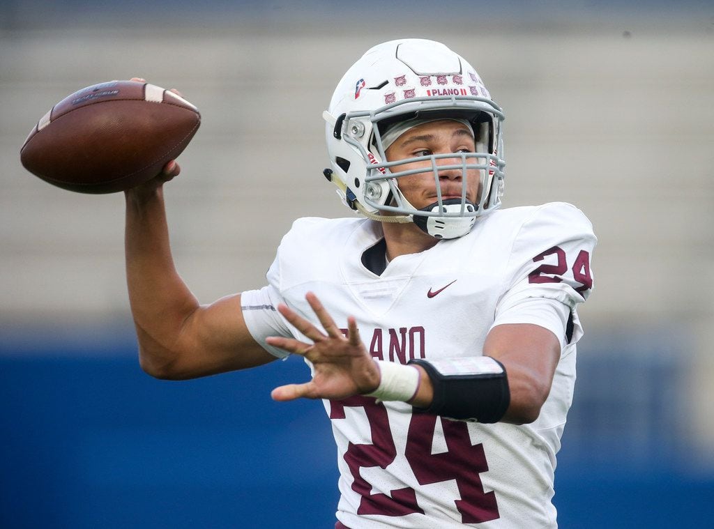 Plano quarterback Oliver Towns (24) looks to make a pass during the first half of a high...
