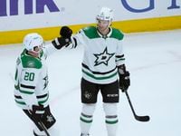 Dallas Stars' Colin Miller (6) celebrates his goal against the Chicago Blackhawks with Ryan...