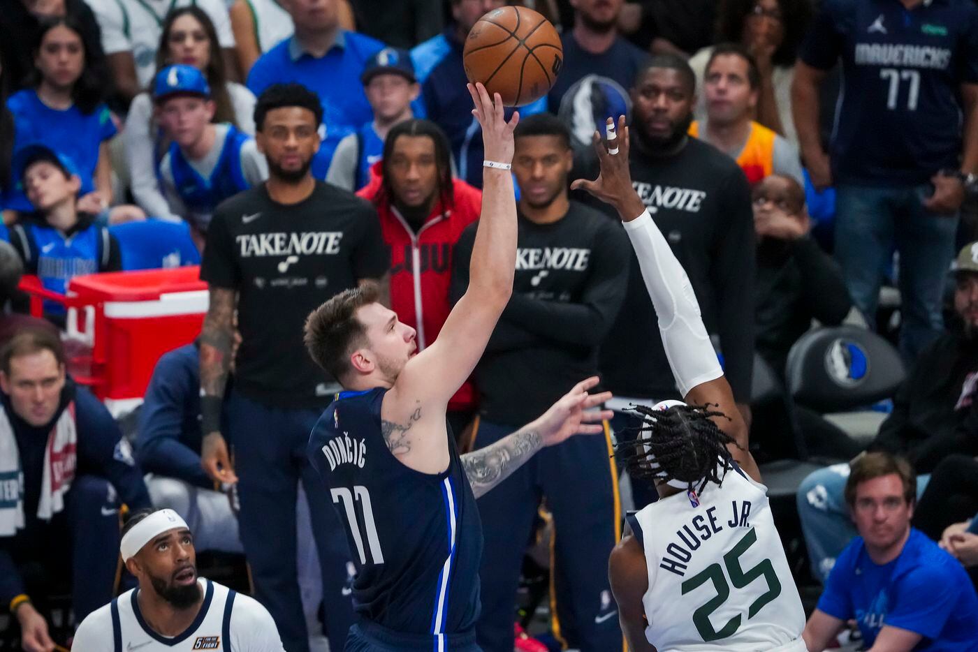Dallas Mavericks guard Luka Doncic (77) shoots over Utah Jazz forward Danuel House Jr. (25)...