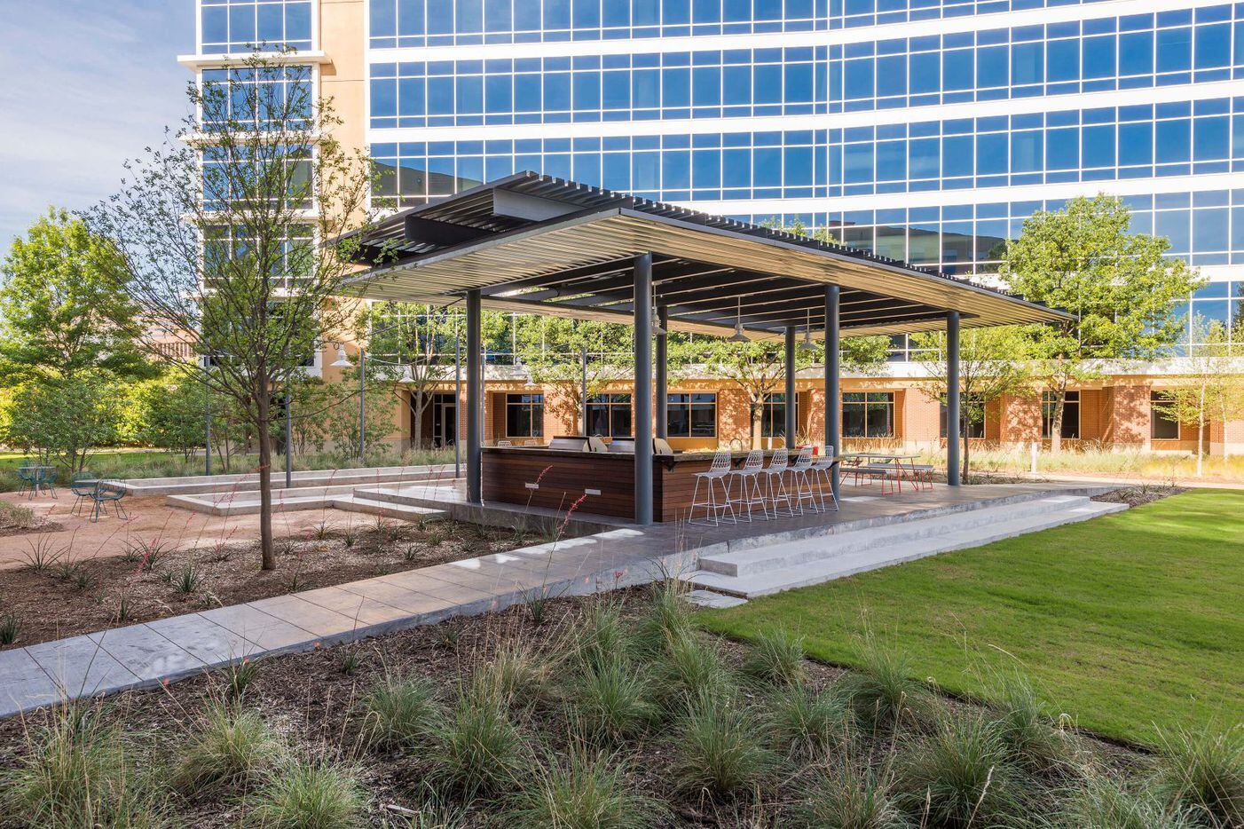 An outdoor serving bar and eating area are among the amenities at the Galatyn Commons office...