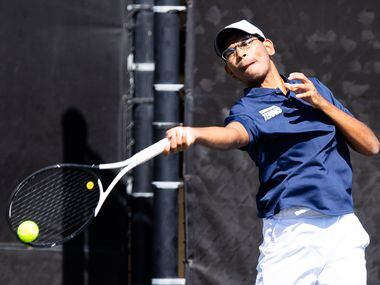 Frisco Centennial’s Tanish Gupt returns a shot during a doubles match with partner Rahul...