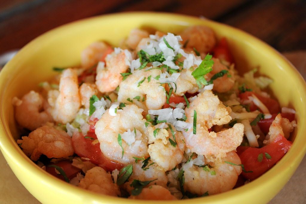 The shrimp bowl features mixed greens, rice, beans, and cheese at La Ventana in Addison, TX...