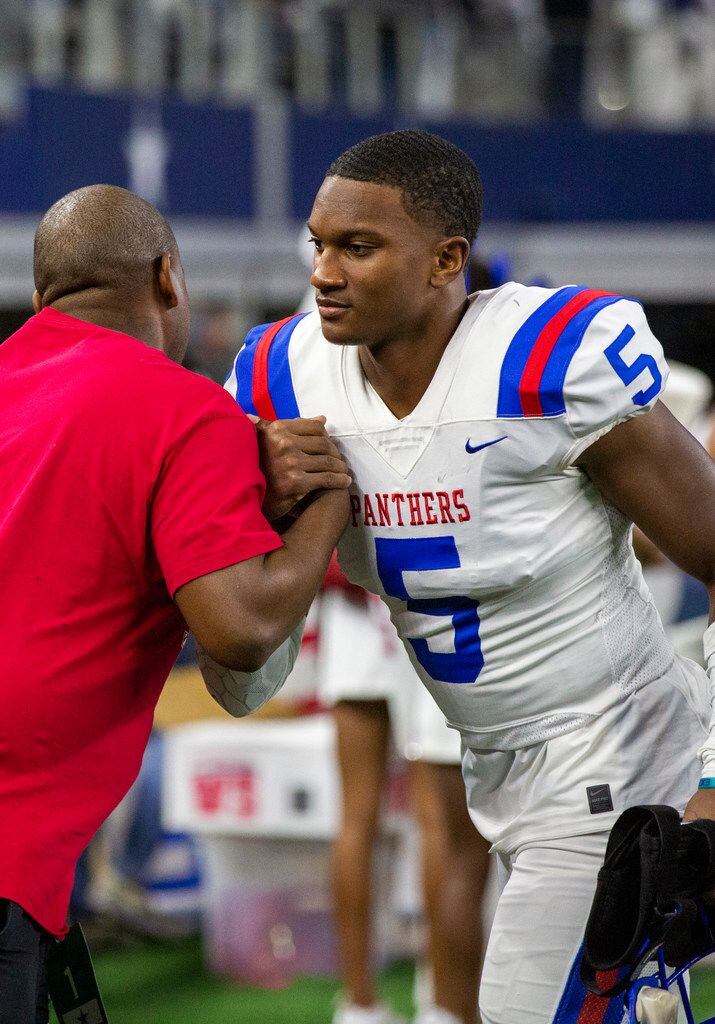 Duncanville defensive back Christopher Thompson Jr. (5) is congratulated after beating...