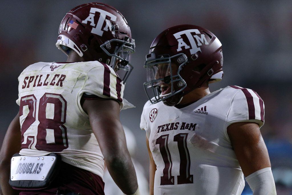 OXFORD, MISSISSIPPI - OCTOBER 19: Isaiah Spiller #28 of the Texas A&M Aggies celebrates a touchdown with Kellen Mond #11 during the second half against the Mississippi Rebels at Vaught-Hemingway Stadium on October 19, 2019 in Oxford, Mississippi. (Photo by Jonathan Bachman/Getty Images)