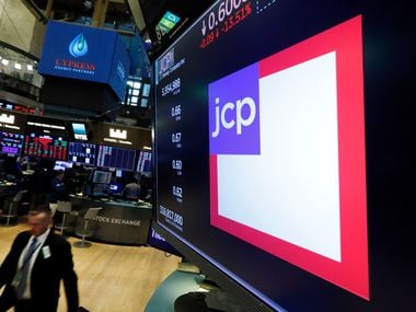 The JC Penney logo appears above a trading post on the floor of the New York Stock Exchange on Aug. 9