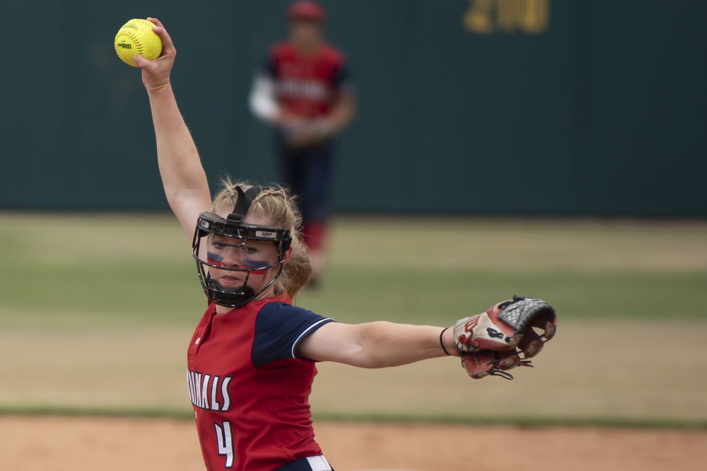 John Paul II freshman Carly Holman (4) delivers a pitch during the TAPPS Softball Division...
