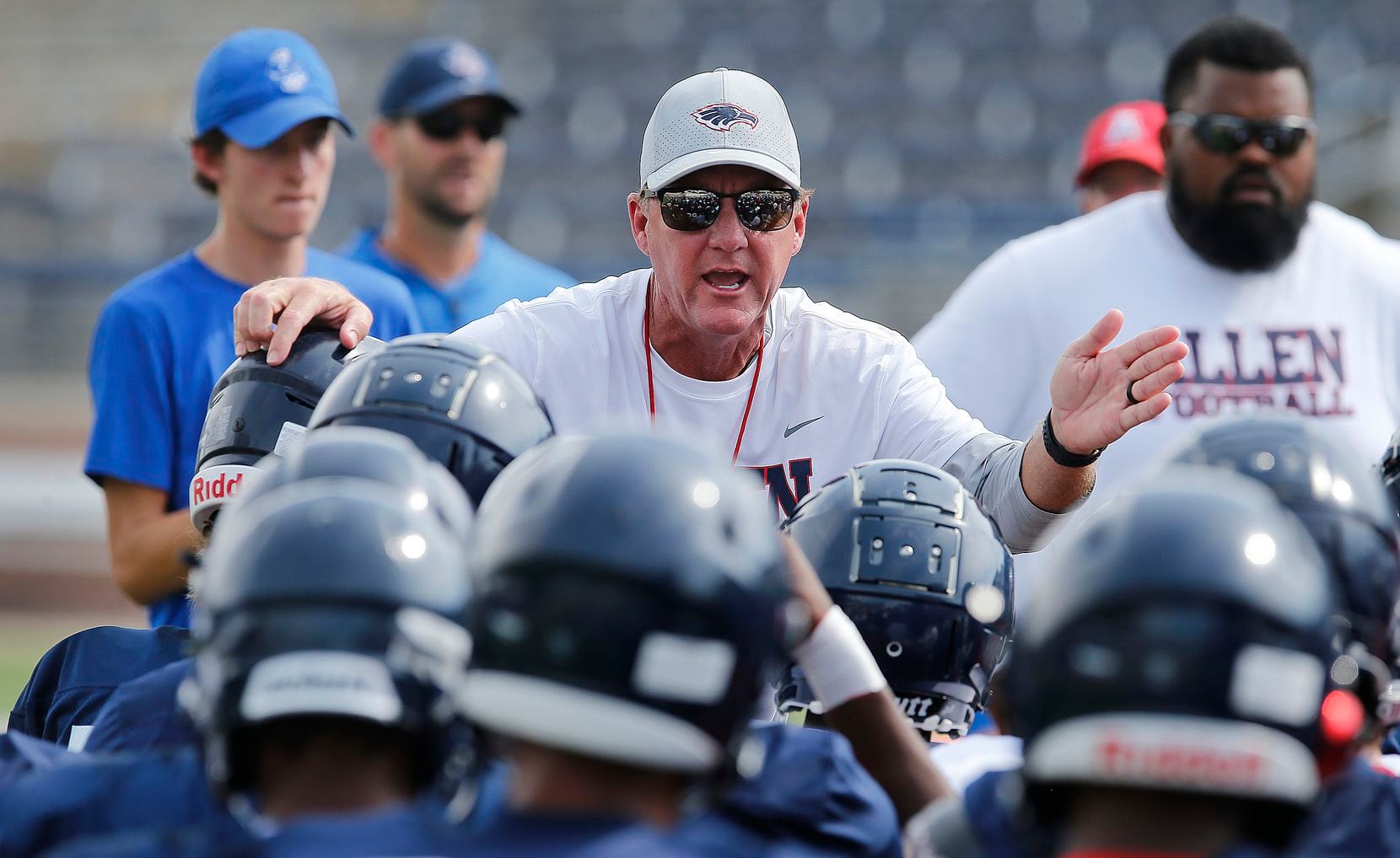 Allen High School head football coach Chad Morris talks to his team before practice after ...