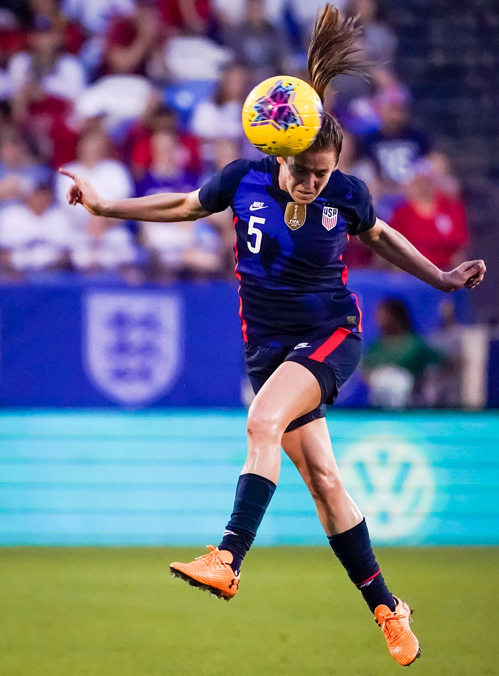 USA defender Kelley O'Hara goes up for a header during the first half of a SheBelieves Cup...