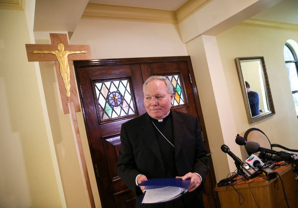 Dallas Bishop Edward J. Burns walks away from the podium after speaking to members of the...