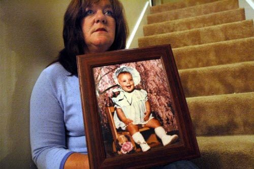 Petti Coats holds a photo of her slain daughter, Chelsea McClellan. Genene Jones was...