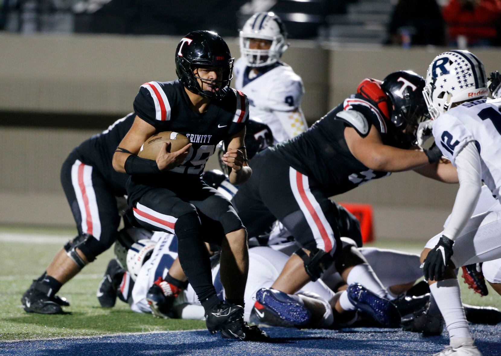 Euless Trinity's Jason Vaomotou (29) scores a rushing touchdown against Richland during the...