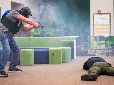 A school marshal participates in an active shooter during in a school safety active shooter...