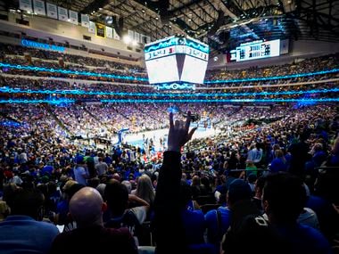 Dallas Mavericks fans cheer a basket during the first half of an NBA playoff basketball game at the American Airlines Center on Friday, June 4, 2021, in Dallas.