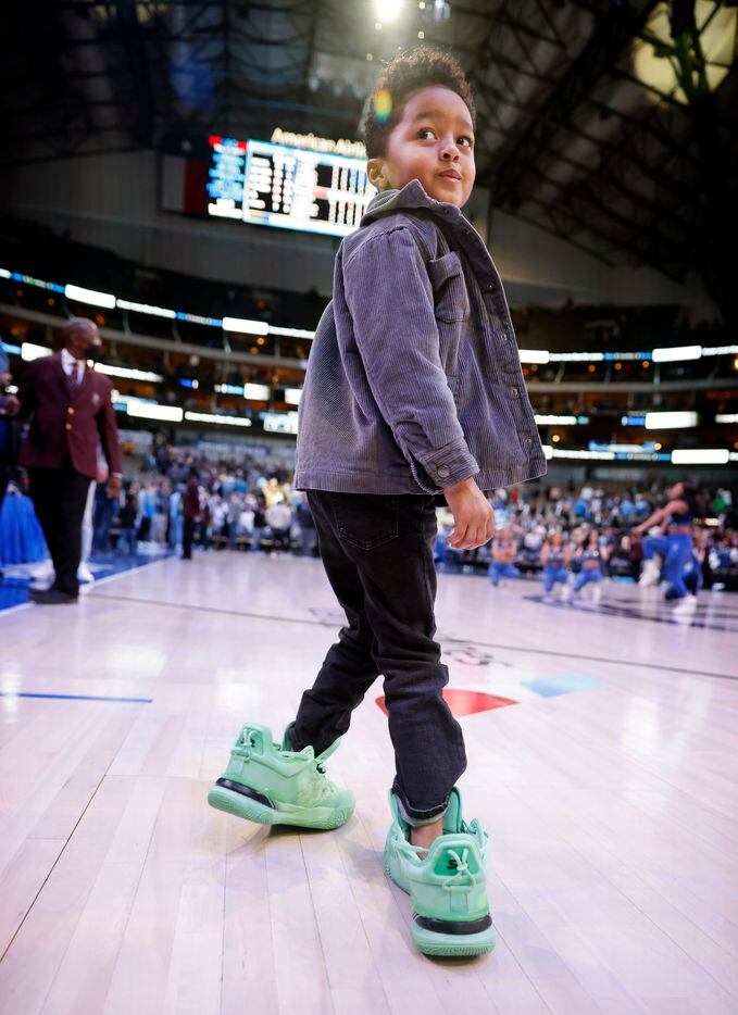 Dallas Mavericks guard Spencer Dinwiddie’s son Elijah wears his dads shoes onto the court...