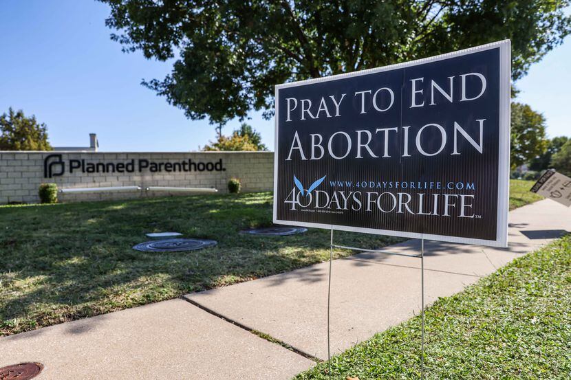 A anti-abortion sign stands on the sidewalk near Planned Parenthood in Dallas on Thursday,...