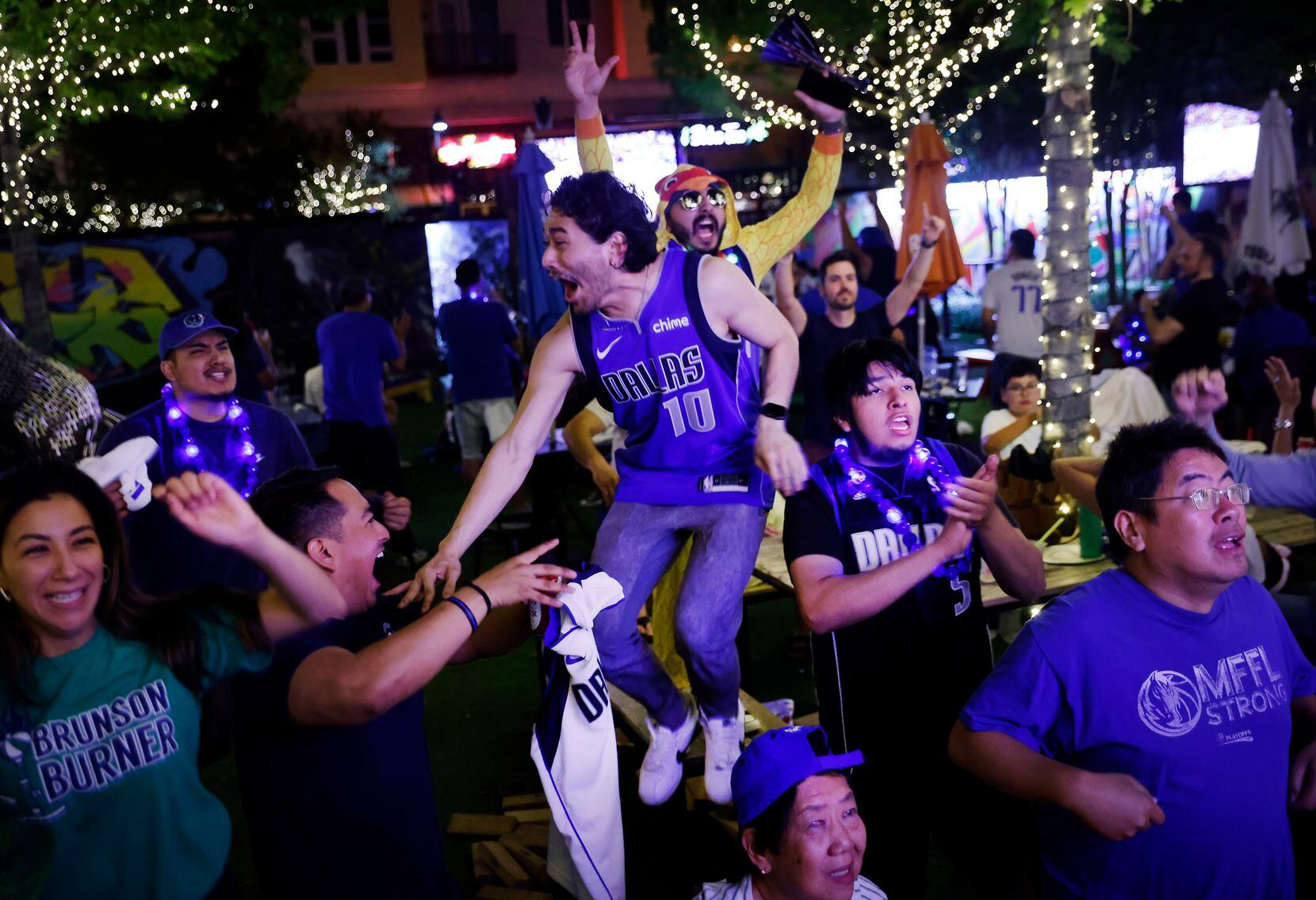 Dallas Mavericks fans celebrate the series win over the Utah Jazz during a Game 6 watch...