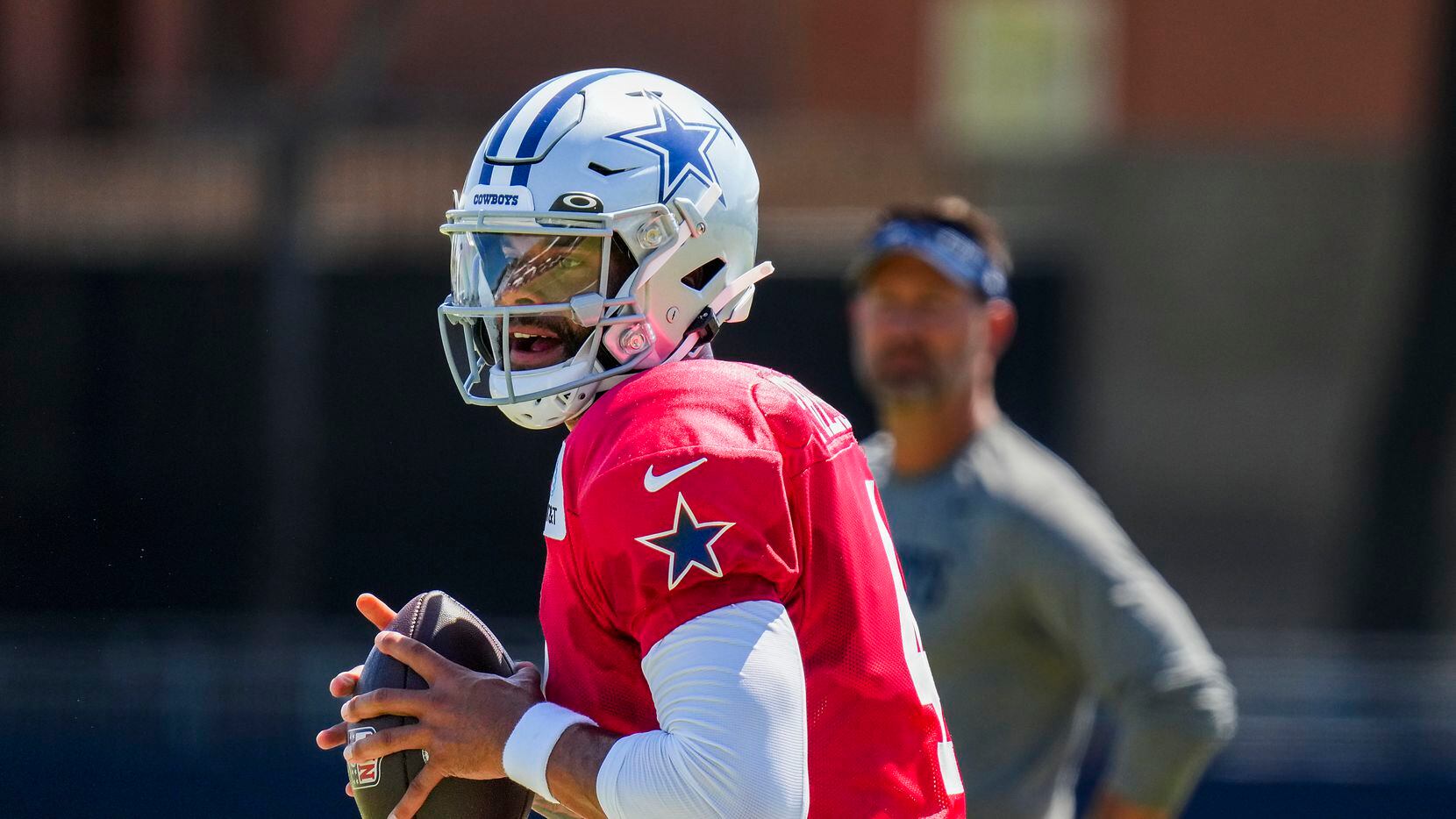 Dallas Cowboys quarterback Dak Prescott looks to pass during a training camp practice on...