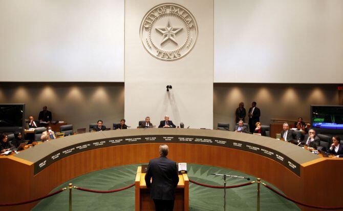 The Dallas City Council hears from a speaker during a meeting in council chambers.
