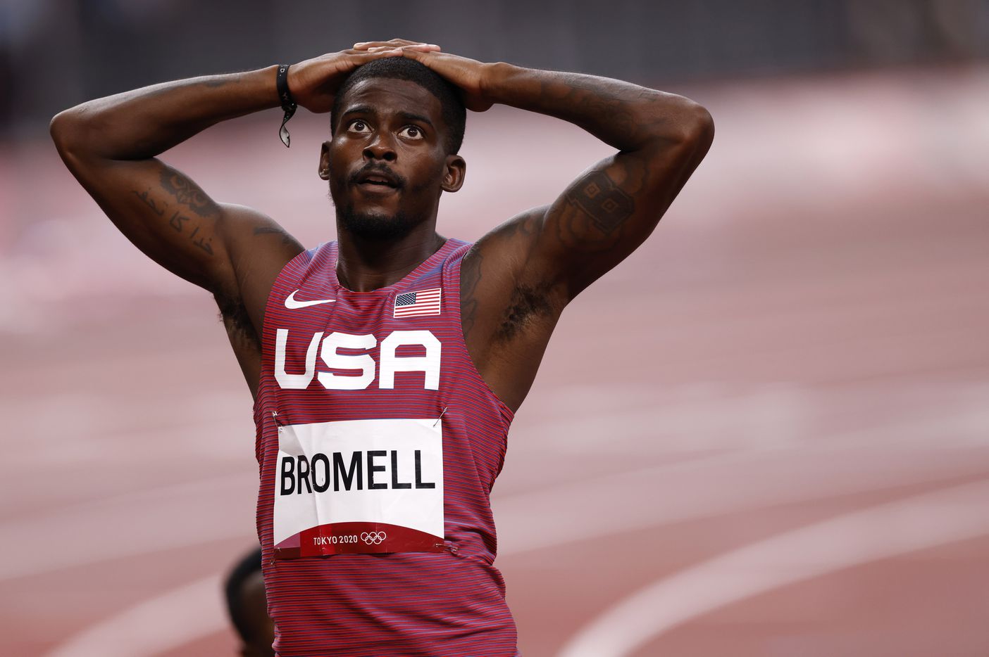USA’s Trayvon Bromell waits for the official time for his run in the men’s 100 meter...