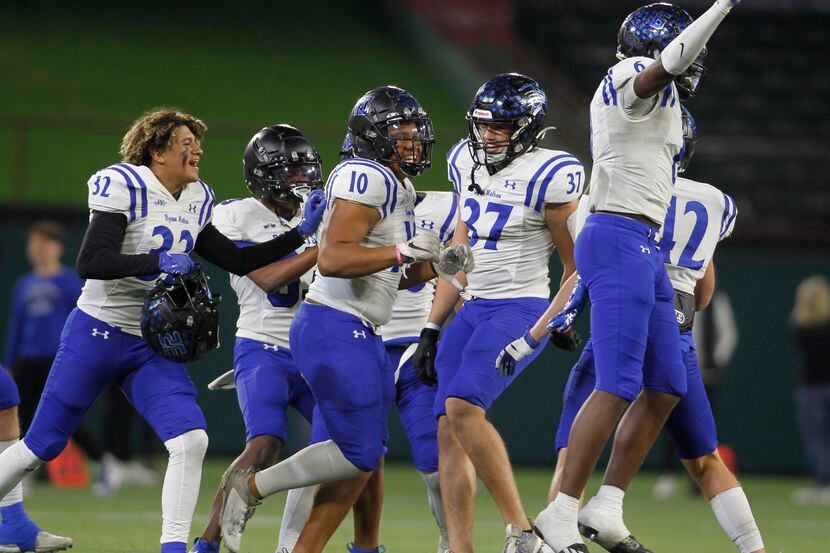 Byron Nelson players celebrate after the final play of their 52-45 victory over Coppell to...