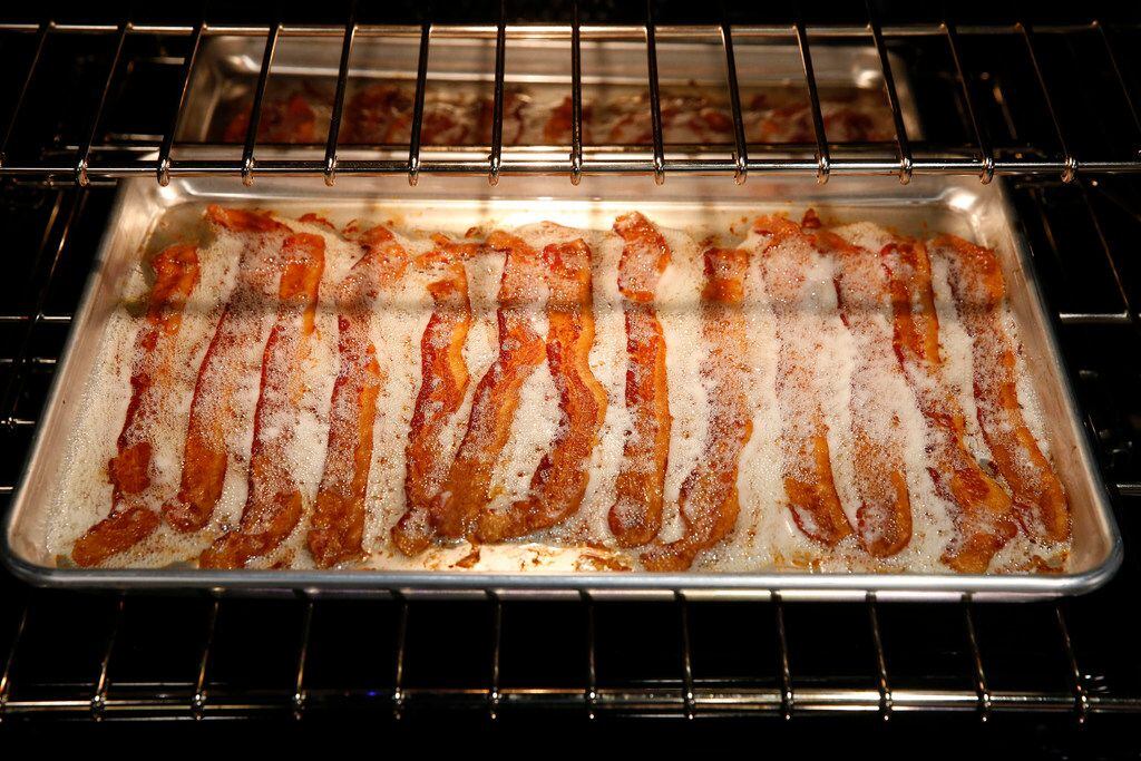 Bacon can be cooked in a half sheet pan and the rolled edge prohibits spillover. 