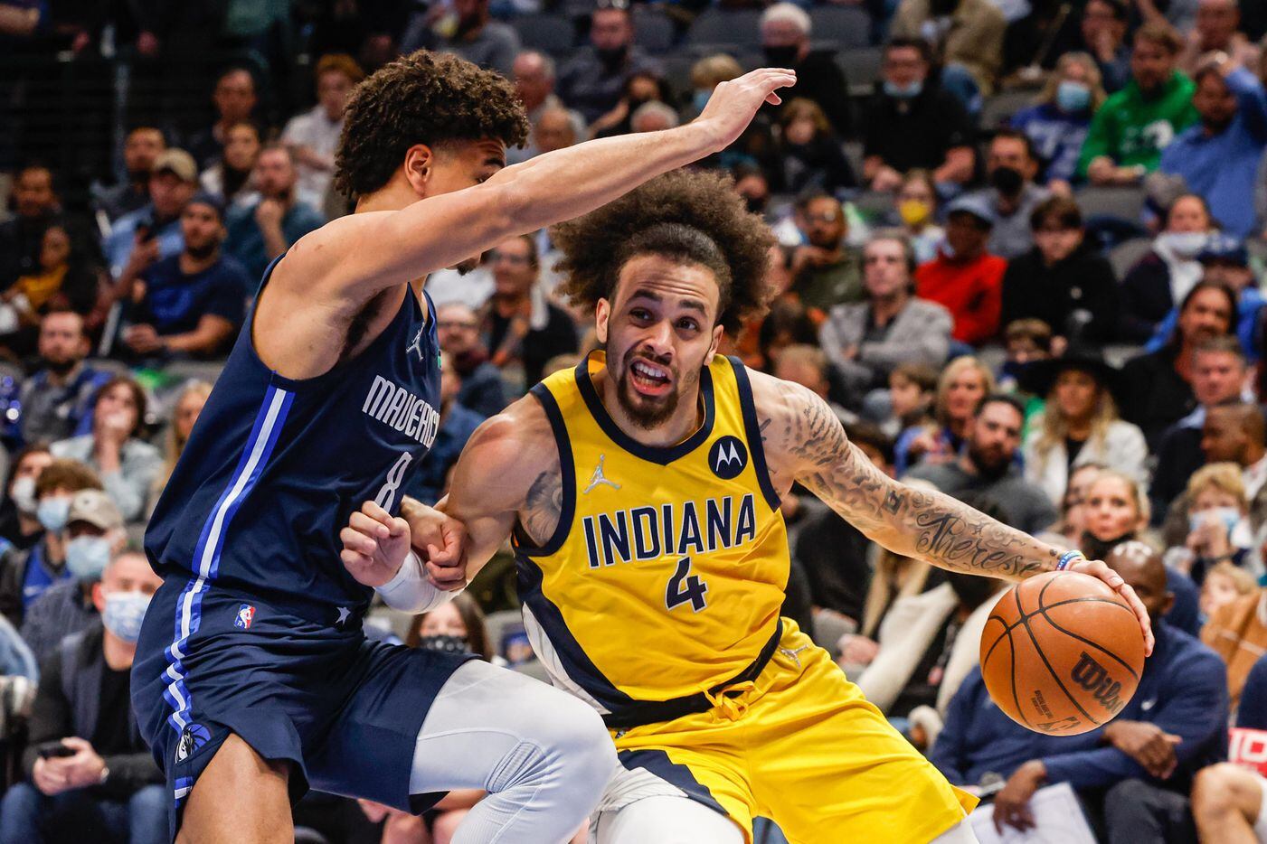 Indiana Pacers guard Duane Washington Jr. (4) protects the basketball against Dallas Mavericks forward George King (8) during a game at the American Airlines Center in Dallas on Saturday, January 29, 2022.