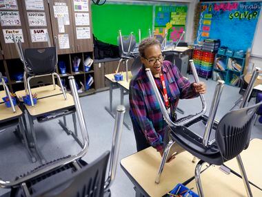 Third grade teacher Schrildea Glover, who also buses kids back and forth to Gilbert Willie...